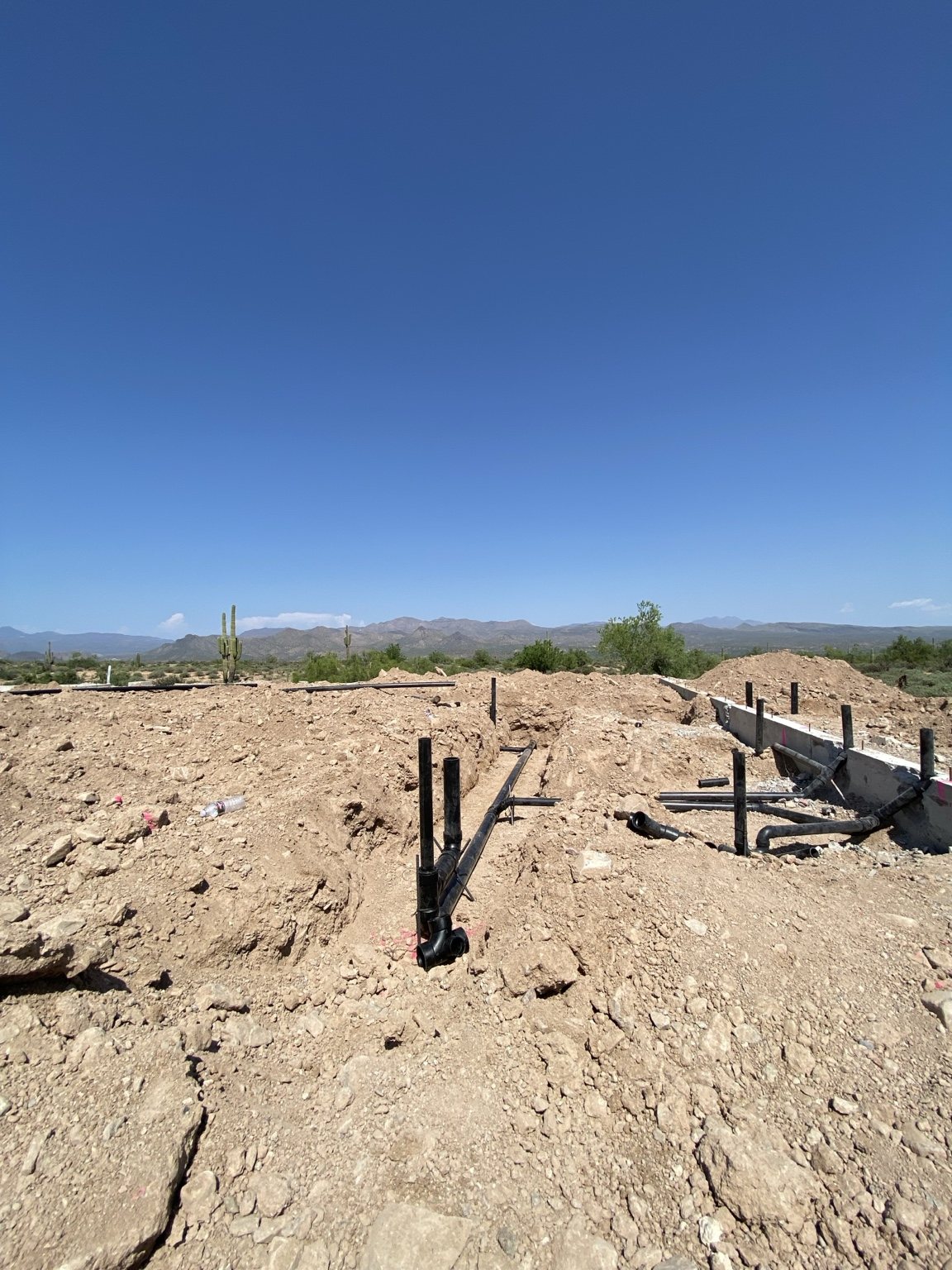 Residential underground plumbing with Arizona mountains in the background
